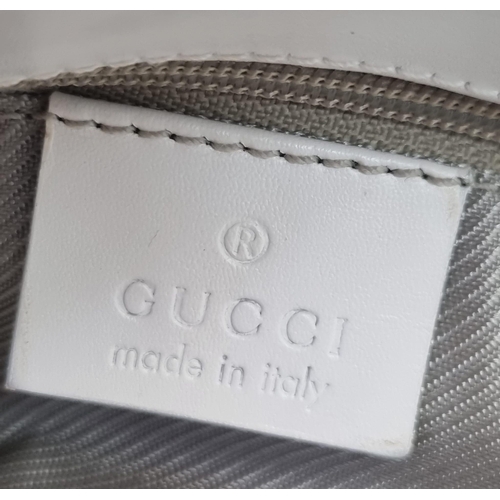 501 - A Baby-Blue Coloured Monogrammed Gucci Canvas Bag. White leather and silver-grey cloth interior with... 