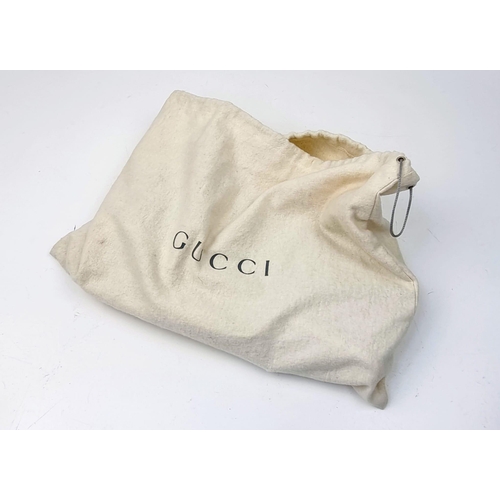 501 - A Baby-Blue Coloured Monogrammed Gucci Canvas Bag. White leather and silver-grey cloth interior with... 