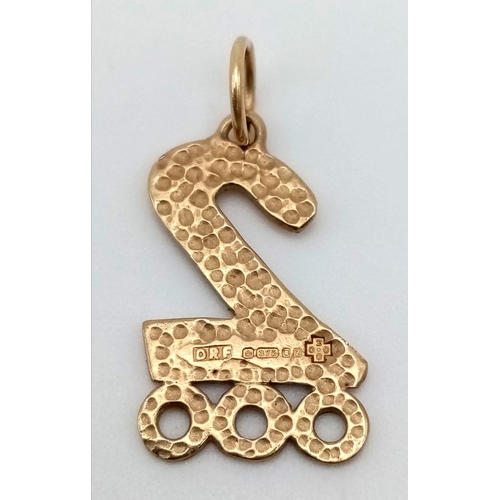 789 - A 9 K yellow gold year 2000 charm. Unusual, handmade design. weight: 2 g.