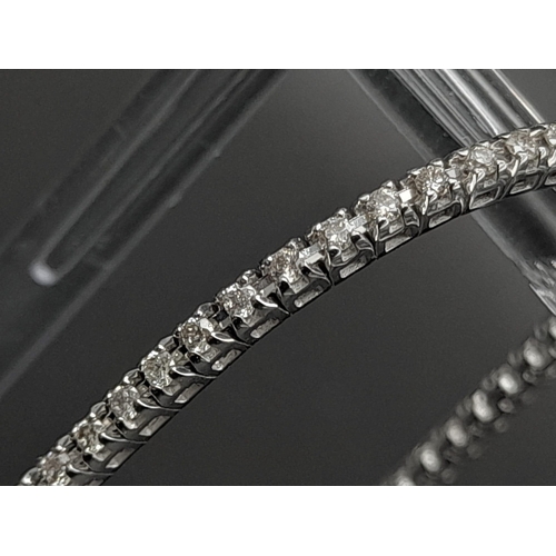 151 - A 18ct White Gold 1.5ct Diamond Line Tennis Bracelet. Simple and Stunning, Length 19cm