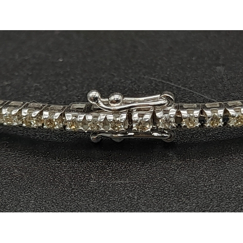 151 - A 18ct White Gold 1.5ct Diamond Line Tennis Bracelet. Simple and Stunning, Length 19cm