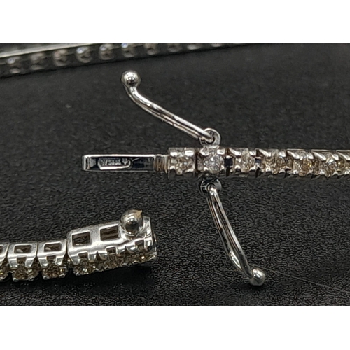 151 - A 18ct White Gold 1.5ct Diamond Line Tennis Bracelet. Simple and Stunning, Length 19cm