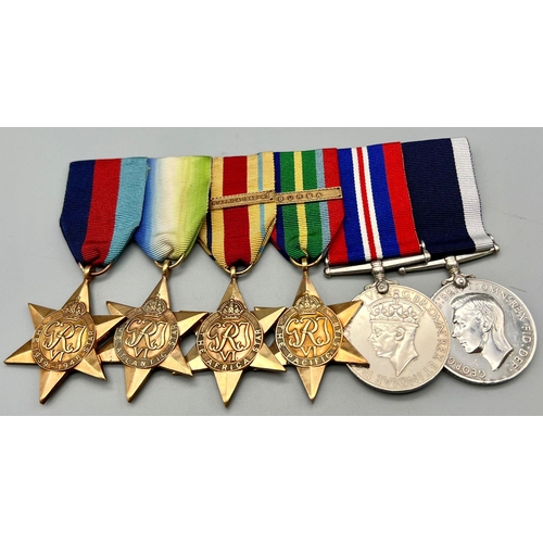 580 - A Royal Navy Long Service and Good Conduct Medal (Geo VI second type, fixed suspender) and WW2 campa... 