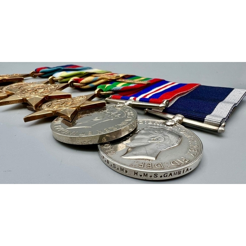 580 - A Royal Navy Long Service and Good Conduct Medal (Geo VI second type, fixed suspender) and WW2 campa... 