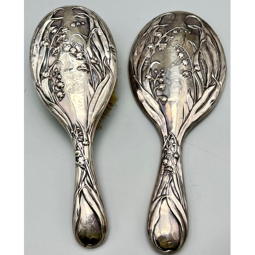 620 - An Antique Sterling Silver Hairbrush and Hand-Mirror. Repoussé floral decoration. Hallmarks for Birm... 