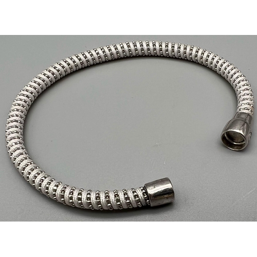 879 - STERLING SILVER WITH WHITE MATERIAL MAGNETIC CLASP BRACELET. 17CM LENGTH