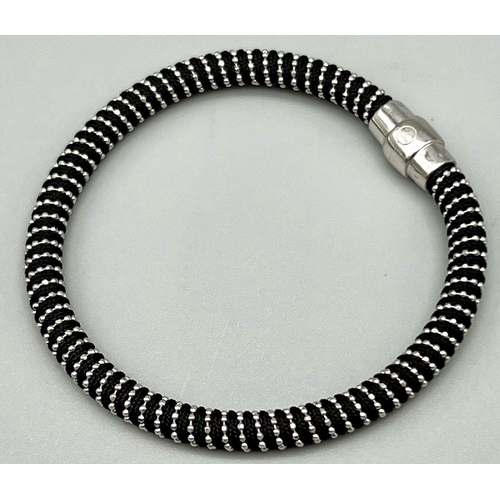 990 - STERLING SILVER WITH BLACK MATERIAL MAGNETIC CLASP BRACELET. 17CM LENGTH