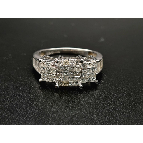 236 - An 18K White Gold Princess-Cut Diamond Ring. Twenty brilliant white central diamonds with twelve dia... 