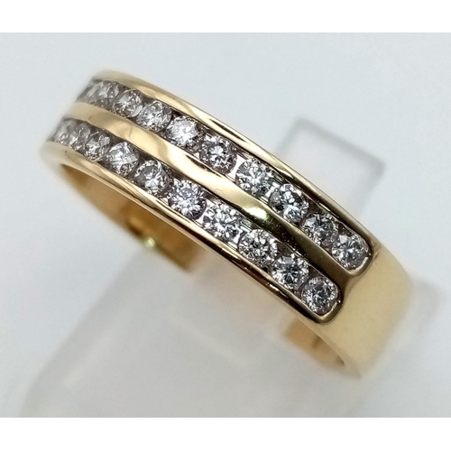 123 - A 9 K yellow gold ring with two diamond (0.50 carats) bands on top. Ring size: R, weight: 5 g.