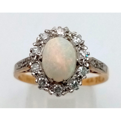 206 - A vintage, 18 K yellow gold and platinum ring with a central opal cabochon surrounded by diamonds. S... 