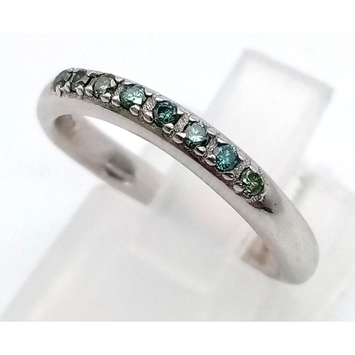 263 - Two 18K White Gold Ladies Rings - Emerald half-eternity ring and an oval cut diamond (.3ct) and emer... 