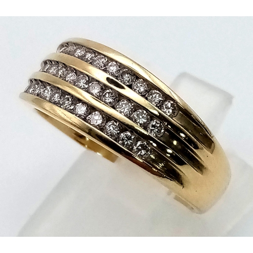 647 - A 9 K yellow gold ring with three diamond (0.35 carats) rows on top. Ring size: N, eight: 3.4 g.