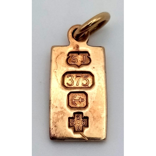 724 - A 9 K yellow gold ingot pendant/charm. Weight: 4 g.