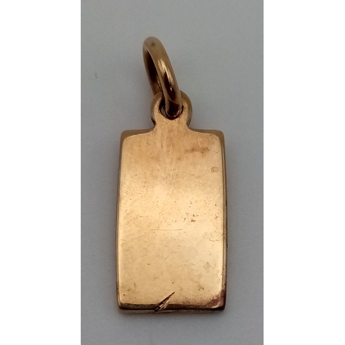 724 - A 9 K yellow gold ingot pendant/charm. Weight: 4 g.