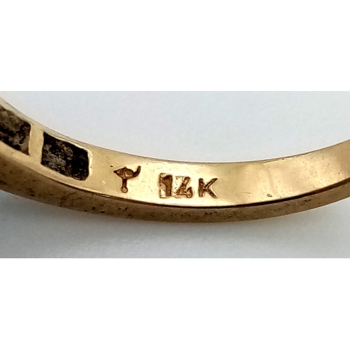 950 - A 14 K yellow gold ring with a band of diamonds (0.35 carats). Ring size: N, weight: 2.2 g.