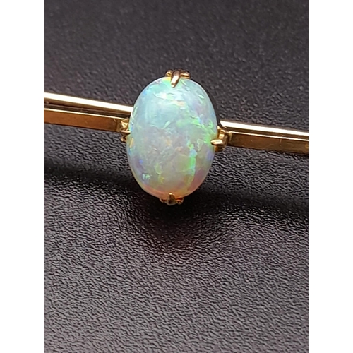 155 - A Natural Opal 15K Yellow Gold Pin Brooch. Incredible dancing colours from a 2ct central fire opal.
... 