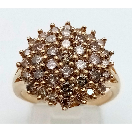 108 - A Champagne Diamond 9K Gold Cocktail Ring. Graduating diamond halos create a wonderful effect. Size ... 