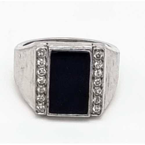 249 - An 18k White Gold Gents Black Onyx and Diamond Swivel Signet Ring. Size P. 25.11g total weight. Ref:... 