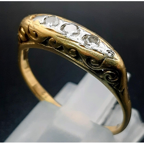 374 - A vintage 18 K yellow gold & platinum ring with a trilogy of diamonds. Size: Q, weight: 3.7 g.