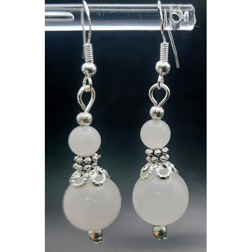 419 - A Pair of Graduated White Jade Ball Drop Earrings. 2.5cm drop