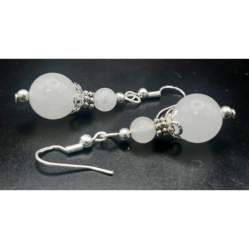 419 - A Pair of Graduated White Jade Ball Drop Earrings. 2.5cm drop