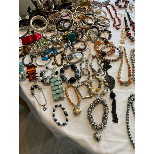 750 - AN ENORMOUS COLLECTION of QUALITY JEWELLERY, together with a colossal selection of BRACELETS and BAN... 