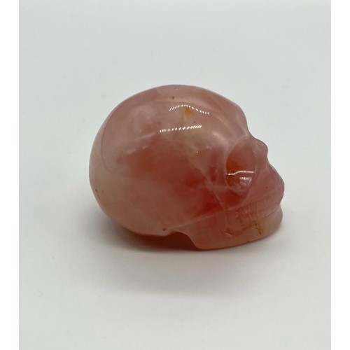 398 - A Rose Quartz Hand-Carved Skull Figure. 5 x 4cm.
The perfect mix of horror and pretty.