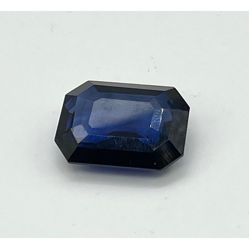 433 - A 44ct Emerald Cut Sapphire Blue Coloured Gemstone. 23 x 20mm. No certificate so as found.