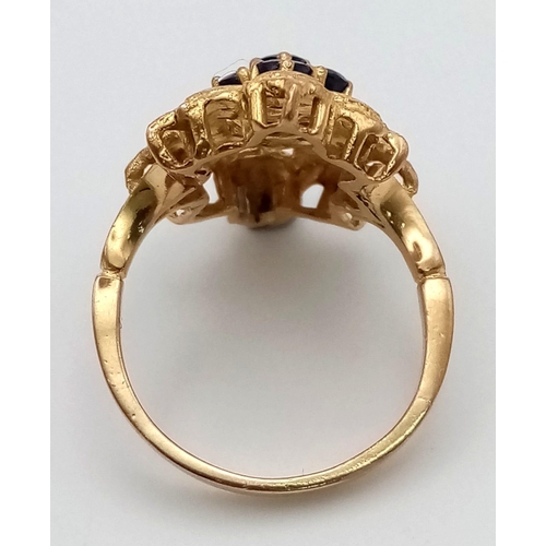 289 - A 1950s High Karat Yellow Gold (20 or more) Sapphire Ring. Eight quality clean sapphires surrounded ... 