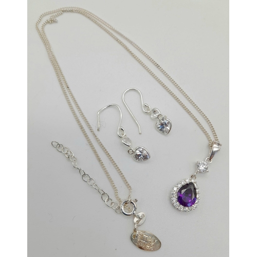 359 - An Amethyst and CZ Pendant and Earring Set. Heart shaped pendant and chain with heart shaped drop ea... 