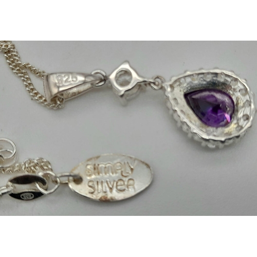 359 - An Amethyst and CZ Pendant and Earring Set. Heart shaped pendant and chain with heart shaped drop ea... 