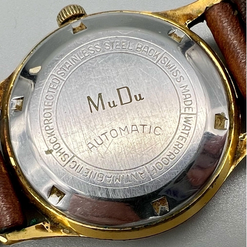 391 - A Vintage Mudu Doublematic Gents Watch. Brown leather strap. Gilded case - 35mm. In working order.