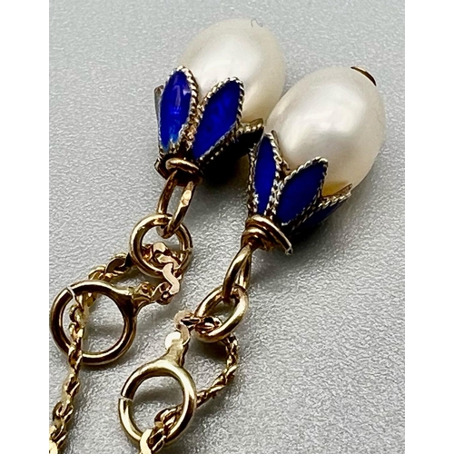 584 - A Fine Pair of Pendeloque Pear-Shaped Pearl Drop Earrings -finished with sky-blue enamelling. Set in... 