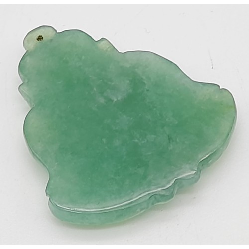 713 - A Green Jade Buddha Pendant. 5 x 4cm.