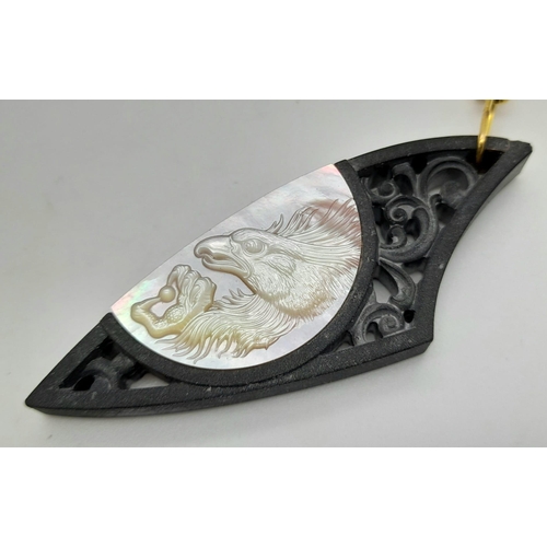 147 - An exquisitely and very detailed, hand carved, mother of pearl on black, carved and pierced stone pe... 