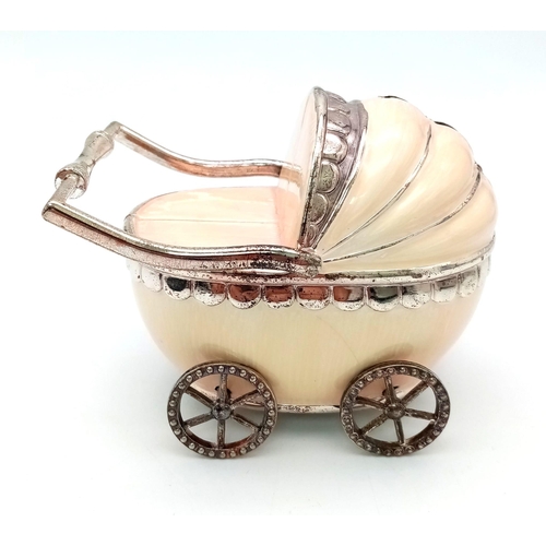 266 - A vintage, baby pram moneybox with over hundred halfpenny coins (various dates) inside. These coins ... 