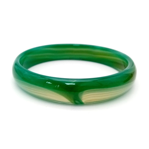 294 - A pair of high quality, green, banded, agate bangles, in original presentation boxes. Internal diame... 