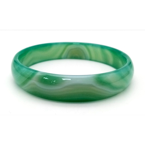 294 - A pair of high quality, green, banded, agate bangles, in original presentation boxes. Internal diame... 