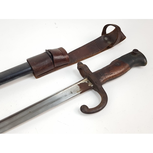 300 - An Antique French Model 1874/77 Bayonet with Scabbard. Inscription on top of blade 1818. Number 7956... 