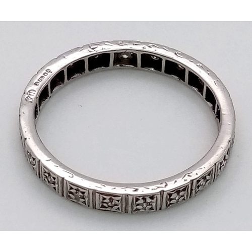 866 - AN 18K WHITE GOLD DIAMOND ETERNITY RING.  4.3gms  size V