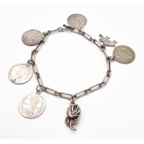 876 - An Antique Silver Threepence Bracelet. Five Edward VII threepence coins. 17cm.