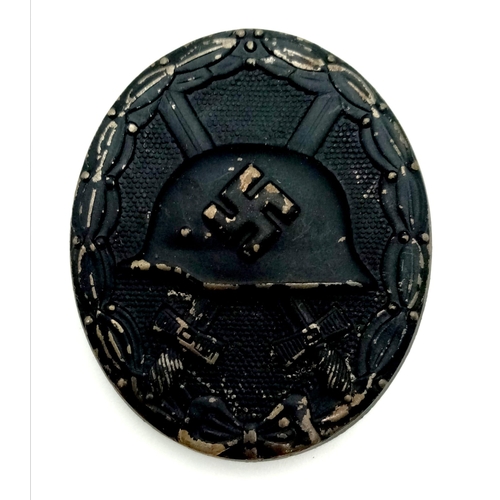 379 - A WW2 German 3rd Class Wound Badge in black representing iron. Awarded for 1or 3 wounds received.