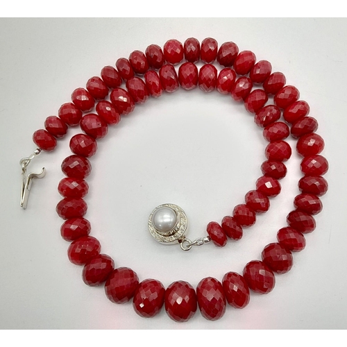 179 - A 530ct African Ruby Gemstone Necklace with a Pearl Clasp set in 925 Silver. 42cm. 105.74g total wei... 