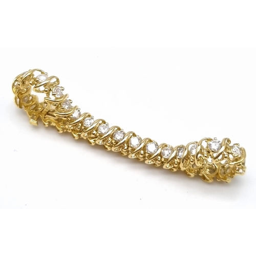 123 - A Serious 18K Yellow Gold Diamond Tennis Bracelet. 31 Brilliant round cut diamonds - Approx 4.5ct. 1... 