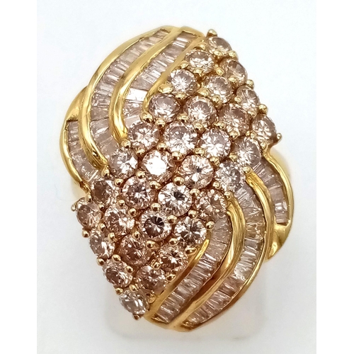 249 - An 18K Yellow Gold Diamond Wave Ring. Four diagonal rows of round cut diamonds with three waves of b... 