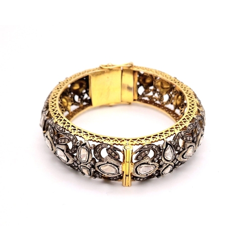 271 - An Antique High Karat Gold, Platinum and Diamond Bangle. Rich gold covered with a platinum foundatio... 