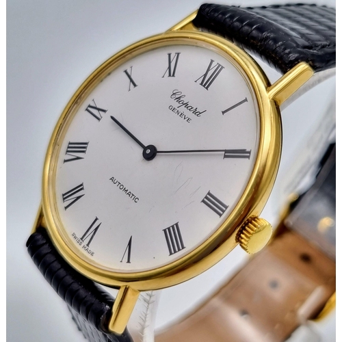 250 - A Chopard 18k Gold Cased Automatic Gents Watch. Black leather strap. Gold case - 33mm. White dial. I... 