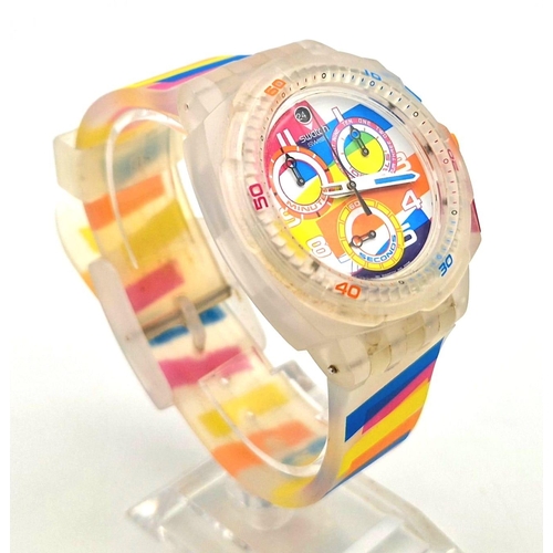 322 - A Swatch Summer Curves Chronograph Watch. Multi-coloured strap and case. In good condition and worki... 