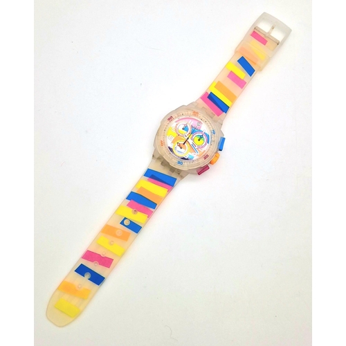 322 - A Swatch Summer Curves Chronograph Watch. Multi-coloured strap and case. In good condition and worki... 