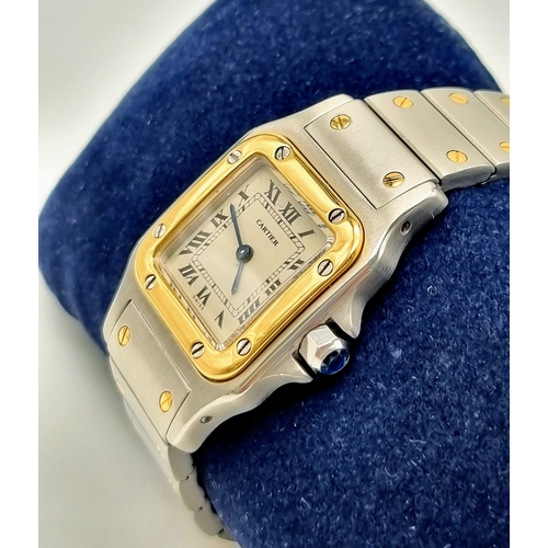 167 - A LADIES GOLD AND STEEL CARTIER WRISTWATCH WITH QUARTZ MOVEMENT. 24mm